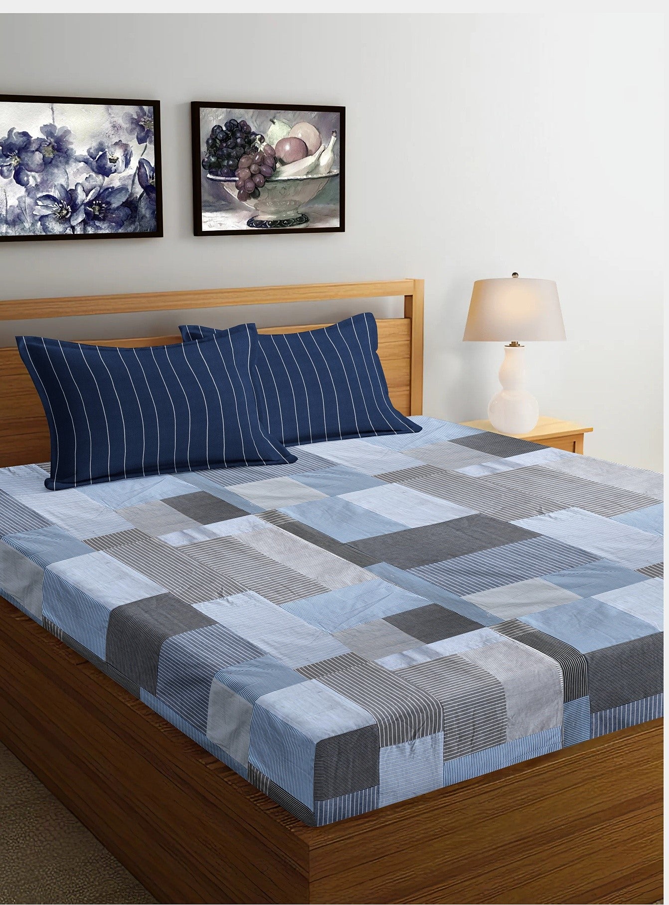 Eco-friendly patchwork bedsheet in blue and grey tones, made from upcycled textiles by Bunko Junko. Perfect for adding a sustainable and stylish touch to your bedroom decor