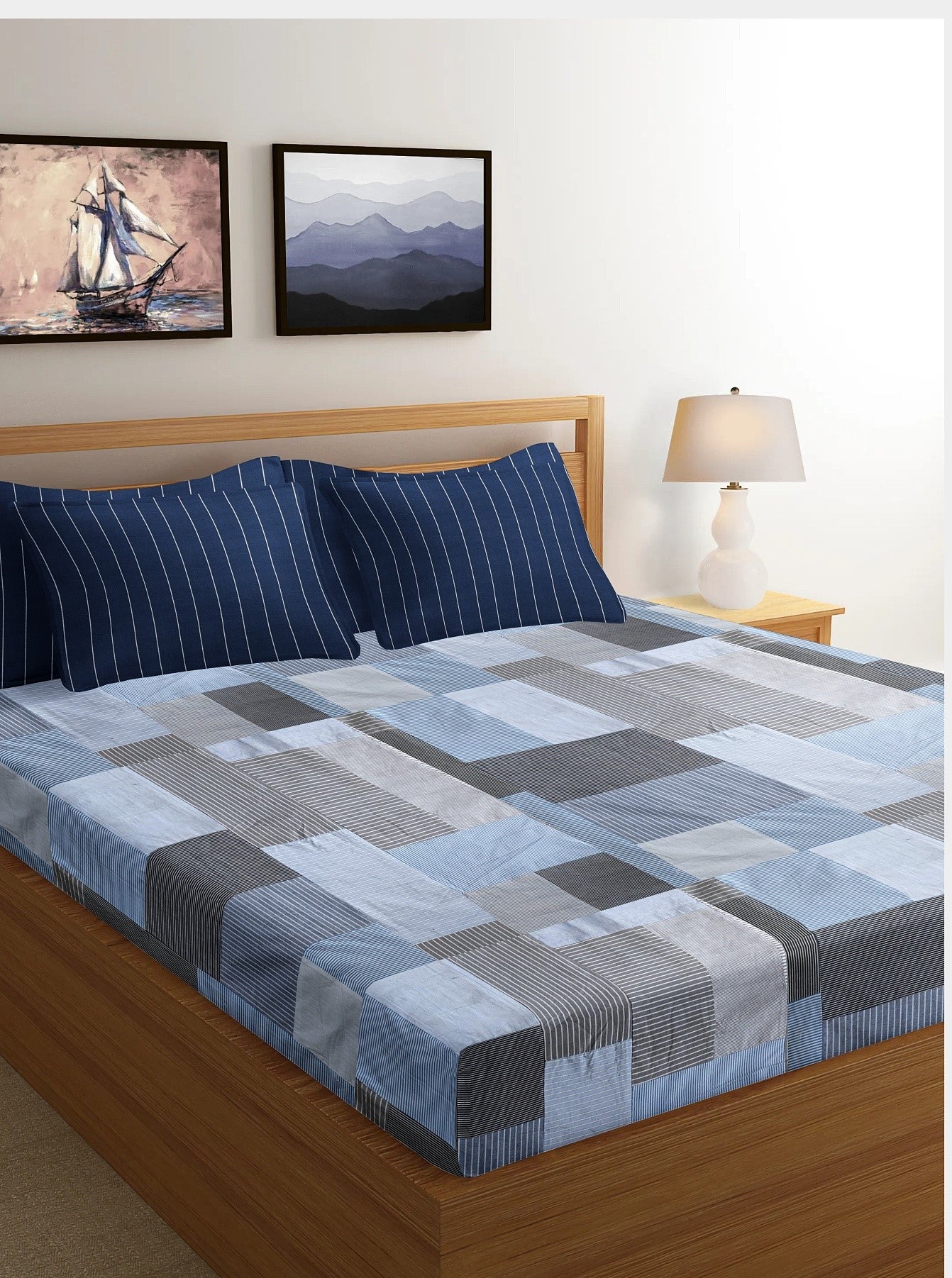 Eco-friendly patchwork bedsheet in blue and grey tones, made from upcycled textiles by Bunko Junko. Perfect for adding a sustainable and stylish touch to your bedroom decor