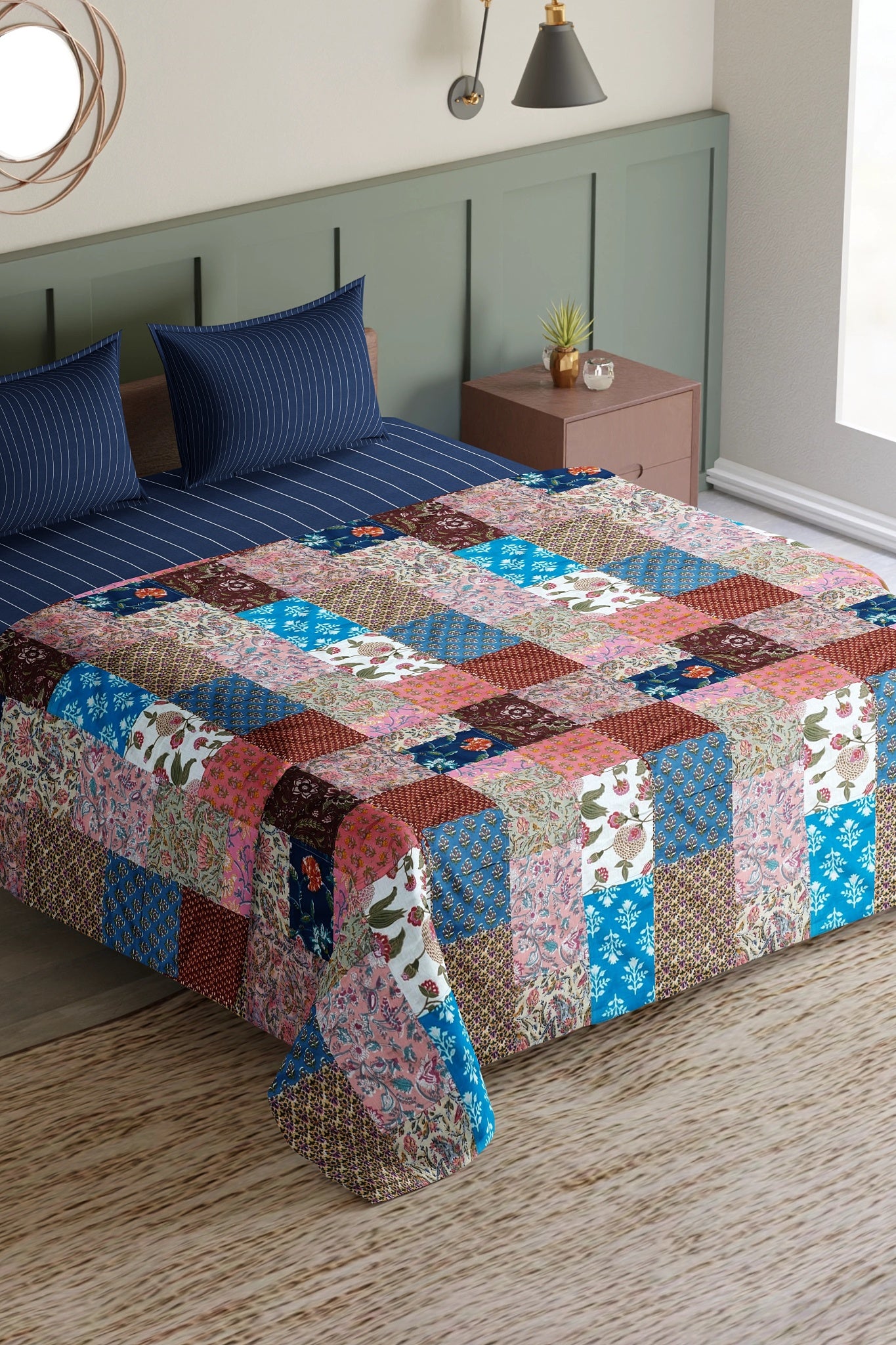Colorful ethnic print patchwork bed quilt by Bunko Junko, showcasing vibrant and artistic designs with a blend of ethnic patterns. Ideal for adding a unique touch to your bedroom decor.