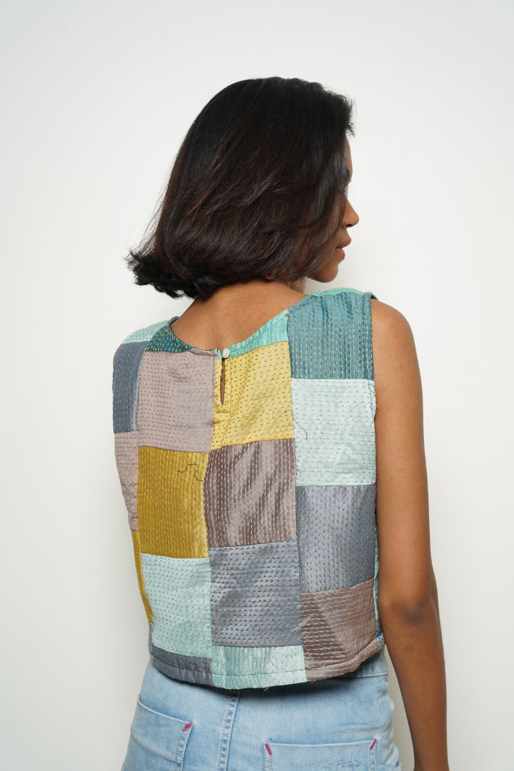 Go Chic Patched Top: A beautiful and stylish top with patches in teal shades.