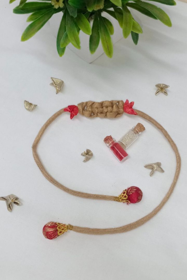 Handcrafted textile Rakhi made from eco-friendly offcuts for Pavitra Tyohar celebration.