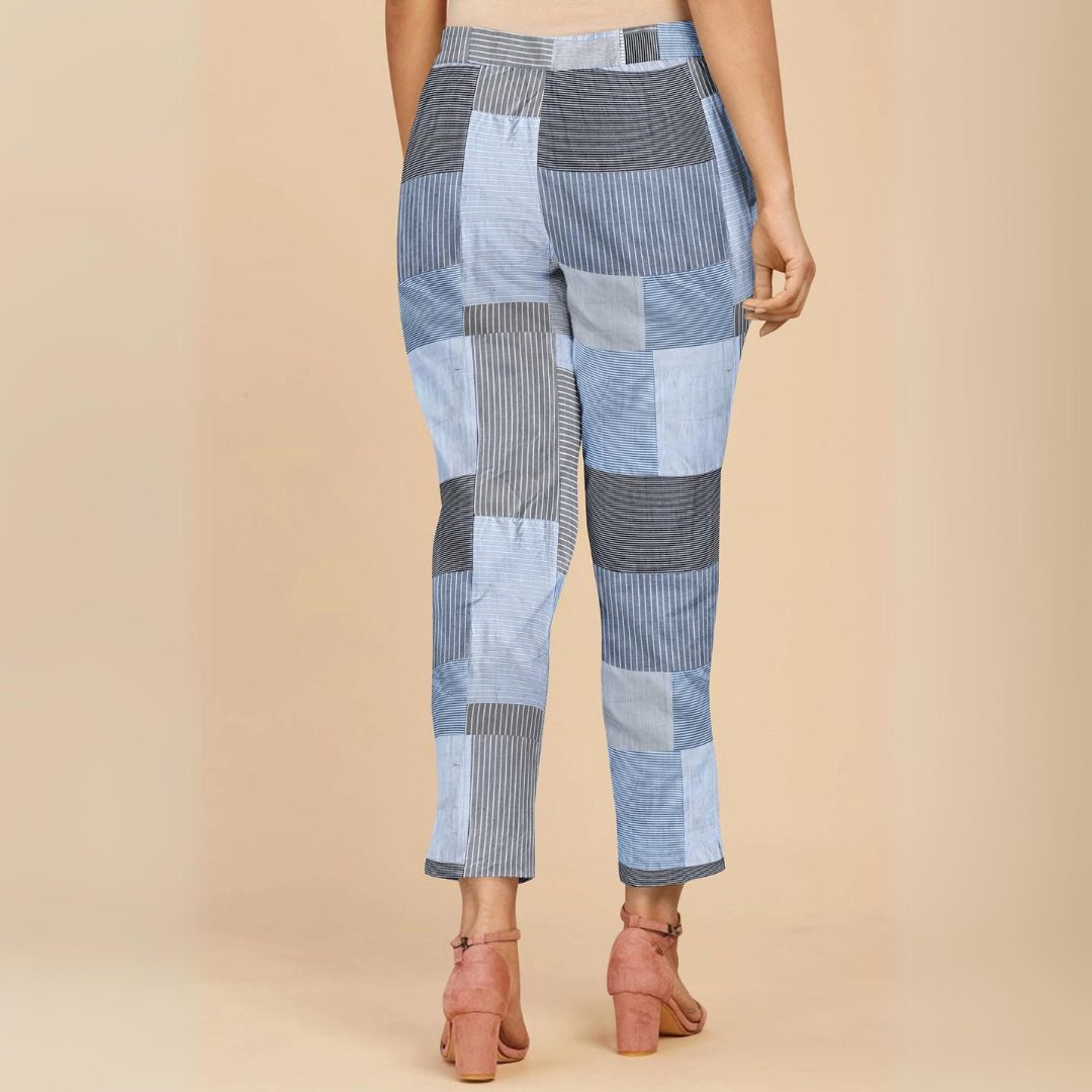 Light blue straight-fit pants with parallel stripes, combining modern elegance and comfort.