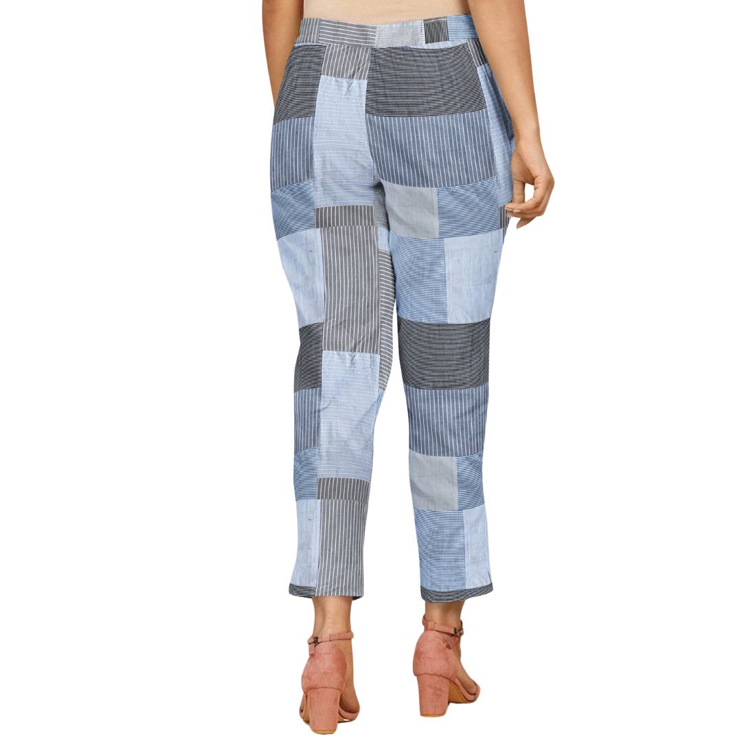 Light blue straight-fit pants with parallel stripes, combining modern elegance and comfort.
