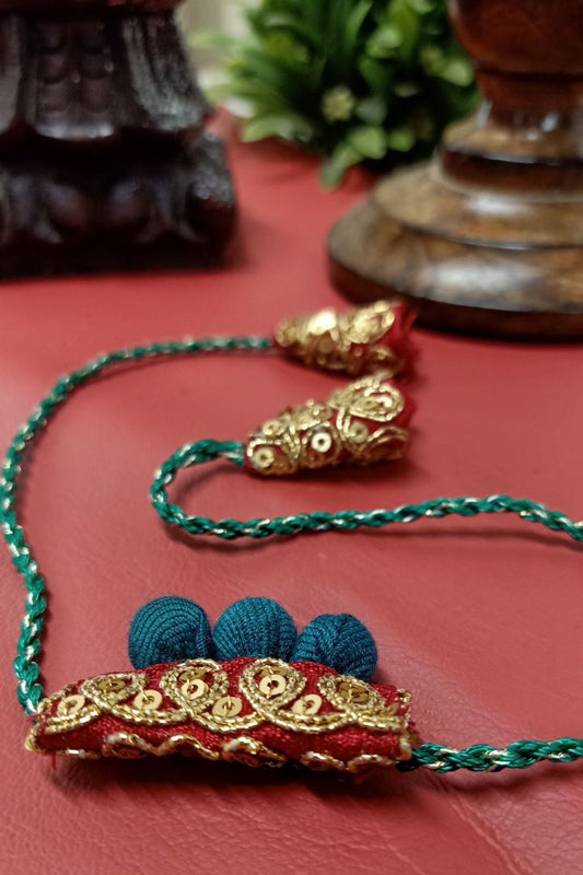 Handcrafted textile Rakhi made from eco-friendly offcuts for Pavitra Tyohar celebration.