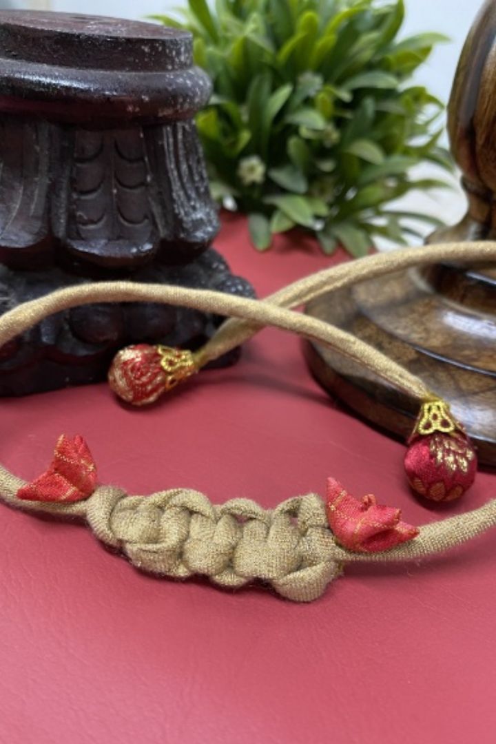 Handcrafted textile Rakhi made from eco-friendly offcuts for Pavitra Tyohar celebration.