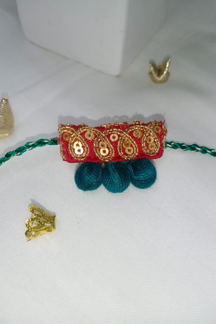 Handcrafted textile Rakhi made from eco-friendly offcuts for Pavitra Tyohar celebration.