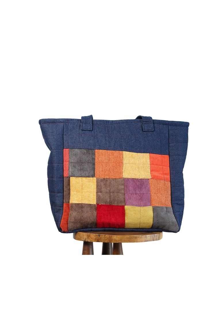 Denim Beach Bag by Bunko Junko: A stylish and durable bag made from upcycled denim, perfect for beach outings.