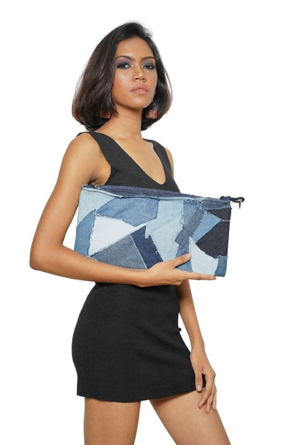 Patchwork Denim Sling by Bunko Junko: A trendy, upcycled denim sling bag featuring a unique patchwork pattern.