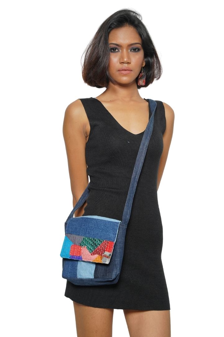 Patchwork Denim Sling by Bunko Junko: A trendy, upcycled denim sling bag featuring a unique patchwork pattern.