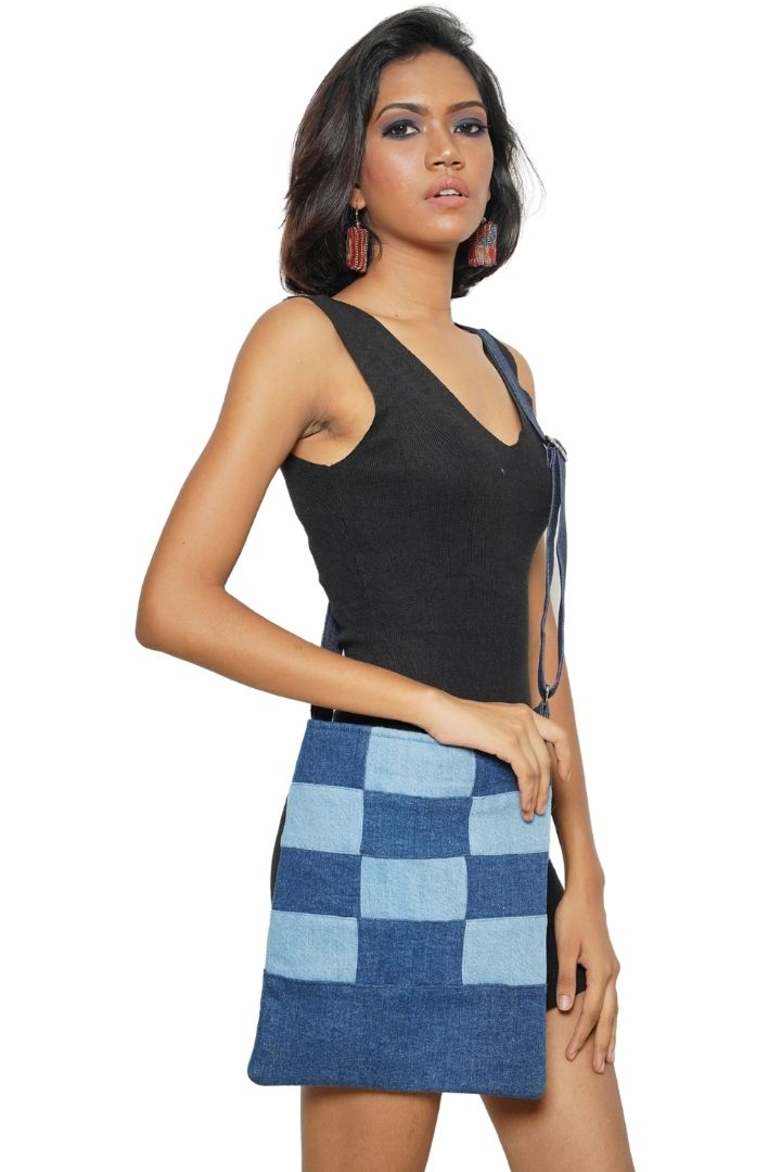 Patchwork Denim Sling by Bunko Junko: A trendy, upcycled denim sling bag featuring a unique patchwork pattern.