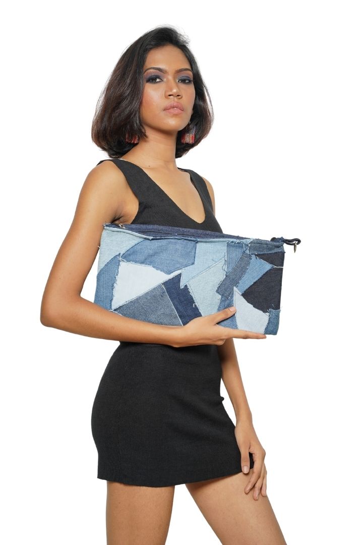 Patchwork Denim Sling by Bunko Junko: A trendy, upcycled denim sling bag featuring a unique patchwork pattern.