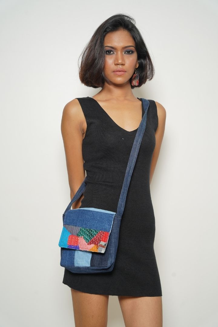 Patchwork Denim Sling by Bunko Junko: A trendy, upcycled denim sling bag featuring a unique patchwork pattern.