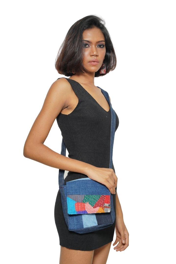 Patchwork Denim Sling by Bunko Junko: A trendy, upcycled denim sling bag featuring a unique patchwork pattern.