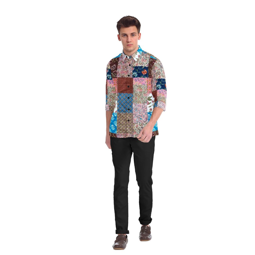 A colorful Kaleidoscope Patchwork Shirt featuring a vibrant mix of upcycled fabrics in various patterns and hues. The shirt showcases a unique, eye-catching patchwork design.