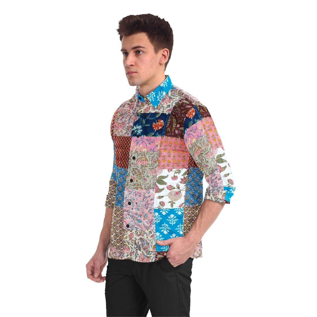 A colorful Kaleidoscope Patchwork Shirt featuring a vibrant mix of upcycled fabrics in various patterns and hues. The shirt showcases a unique, eye-catching patchwork design.