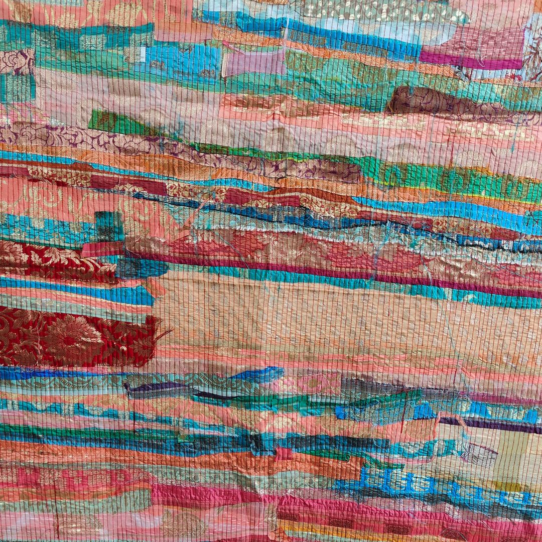 ThreadMosaic Panel by Bunko Junko: An artistic fabric panel featuring a vibrant, upcycled thread mosaic design.