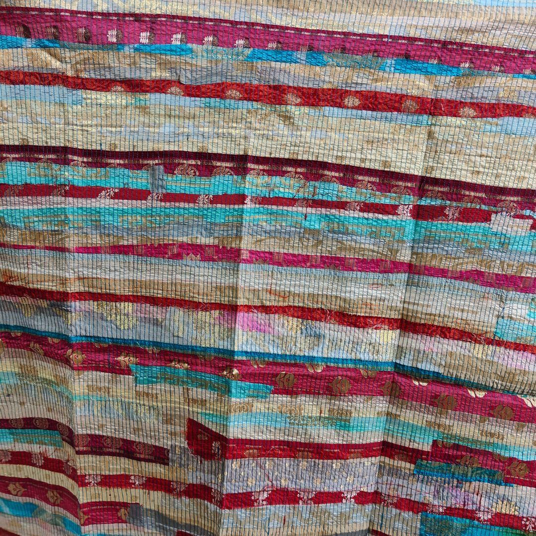 ThreadMosaic Panel by Bunko Junko: An artistic fabric panel featuring a vibrant, upcycled thread mosaic design.