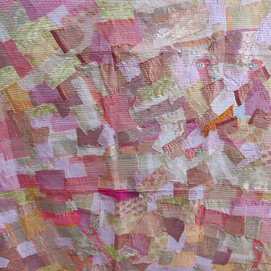 Artisan-crafted scrap fabric panel displaying a patchwork of textures and colors, emphasizing eco-friendly and unique design.