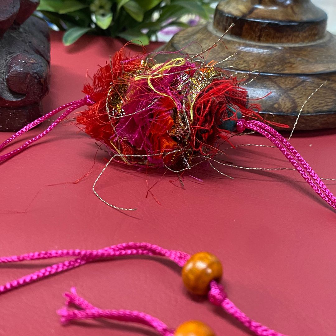 Handcrafted textile Rakhi made from eco-friendly offcuts for Pavitra Tyohar celebration.